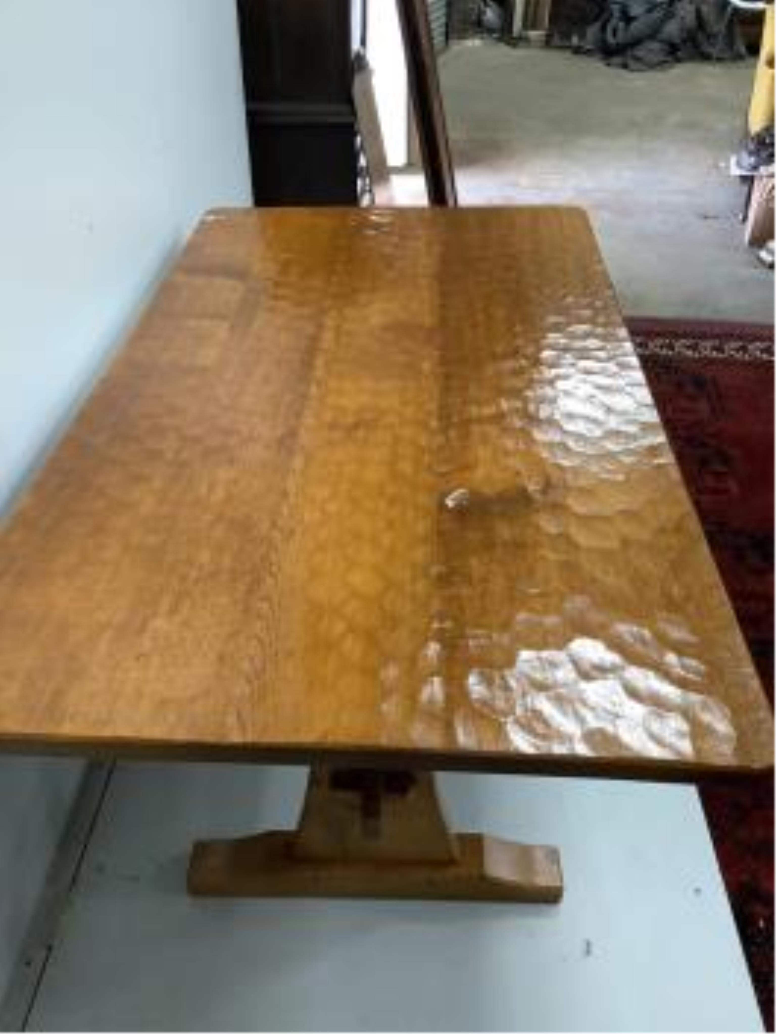 Alan Grainger 'Acorn Man', a rectangular adzed oak refectory dining table on trestle supports, width 186cm, depth 100cm, height 74cm. Condition - good